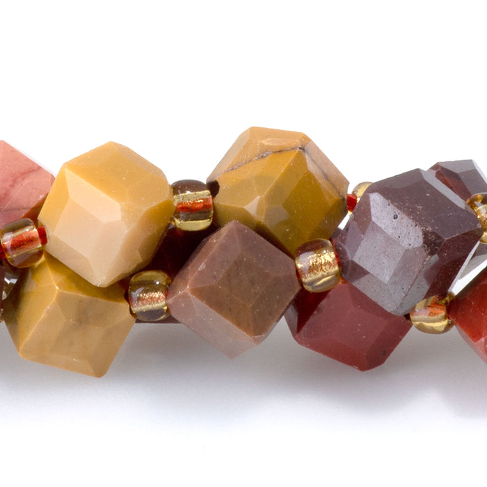 This is a Dakota Stones 6x8mm Mookaite Corner Gemstone strand with table-cut cube beads in 15-16 inch strand.