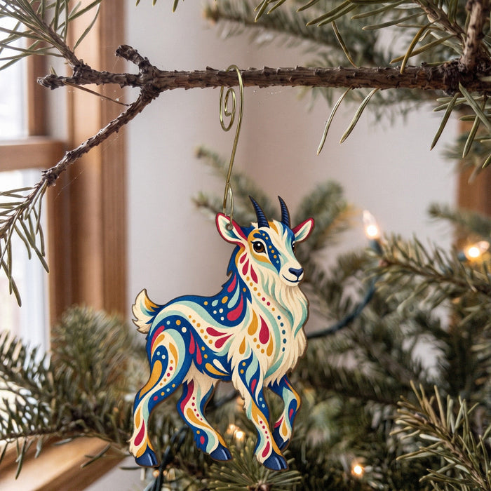 Laser-cut maple wood Mountain Goat folk art ornament O245 hanging on a fir branch, made in USA