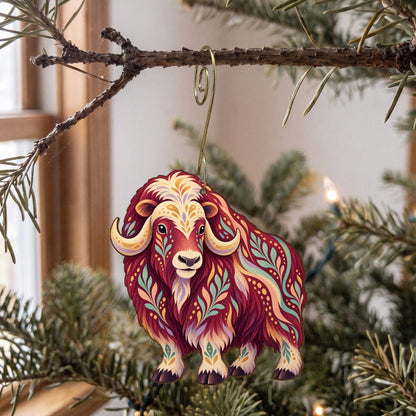 Laser-cut maple wood Musk Ox folk art ornament O246 hanging on a fir branch, made in USA