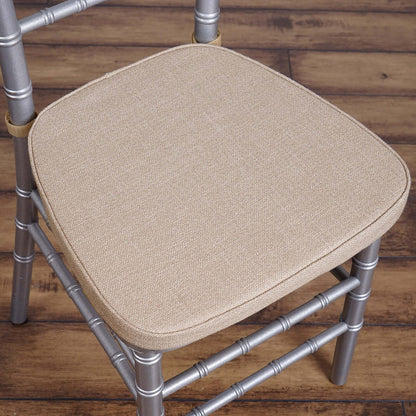 Beige upholstered chair seat with silver metal frame.