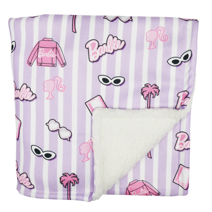 The Sassy Woof Pet Blanket - BARBIE™ Closet Goals features lavender and white stripes, Barbie-themed designs (sunglasses, palm trees, jackets, logos), and a plush white sherpa lining from the Barbie x Sassy Woof collection.