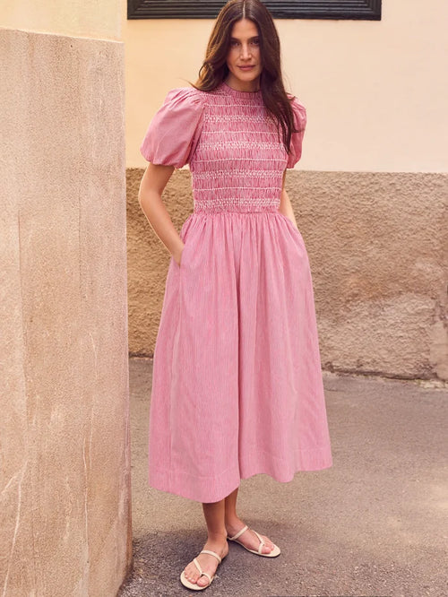 Red stripe midi dress with shirred bodice, puff sleeves, frill neckline and flowing skirt.