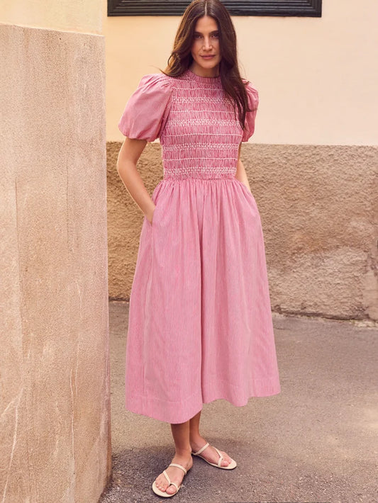 Red stripe midi dress with shirred bodice, puff sleeves, frill neckline and flowing skirt.