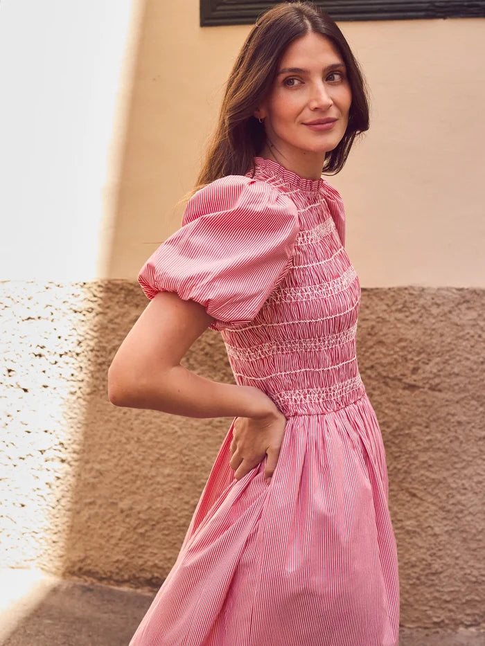 Red stripe midi dress with shirred bodice, puff sleeves, frill neckline and flowing skirt.