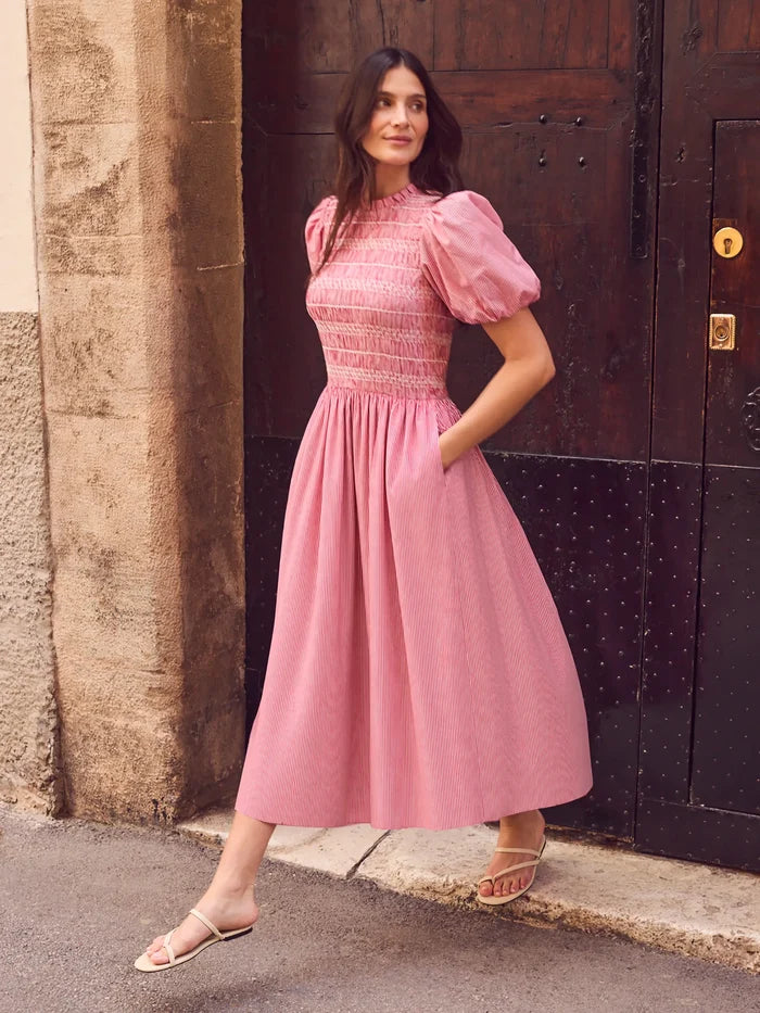 Red stripe midi dress with shirred bodice, puff sleeves, frill neckline and flowing skirt.