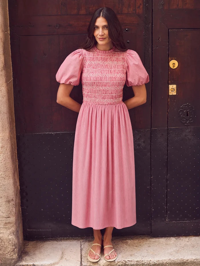Red stripe midi dress with shirred bodice, puff sleeves, frill neckline and flowing skirt.