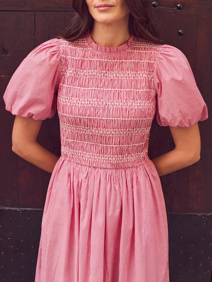 Red stripe midi dress with shirred bodice, puff sleeves, frill neckline and flowing skirt.