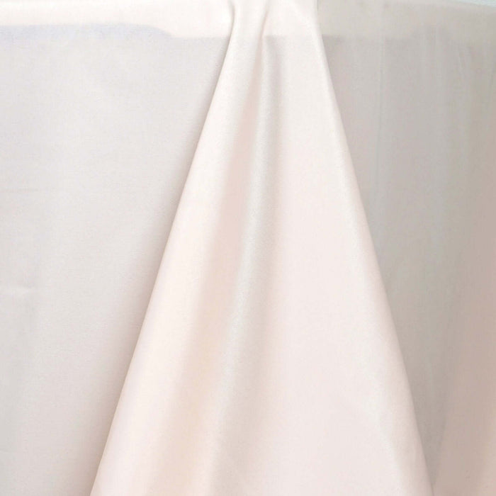 Silky cream tablecloth draped elegantly over a table