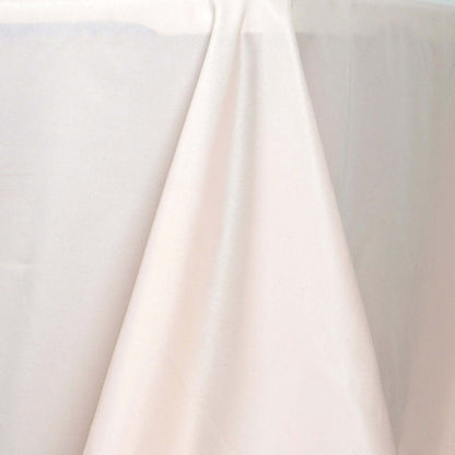 Silky cream tablecloth draped elegantly over a table