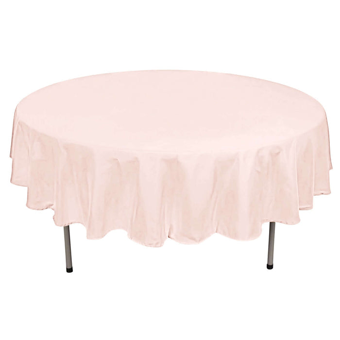 Round pink tablecloth on a round table.