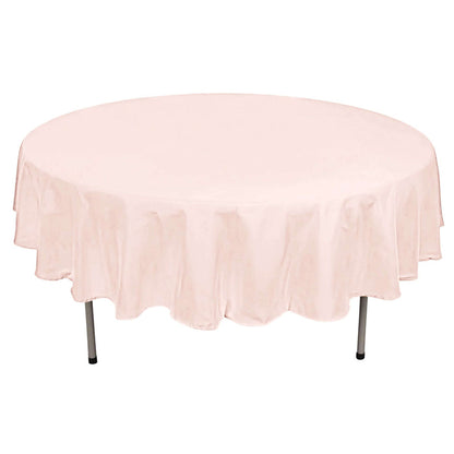 Round pink tablecloth on a round table.