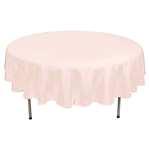 Round pink tablecloth on a round table.