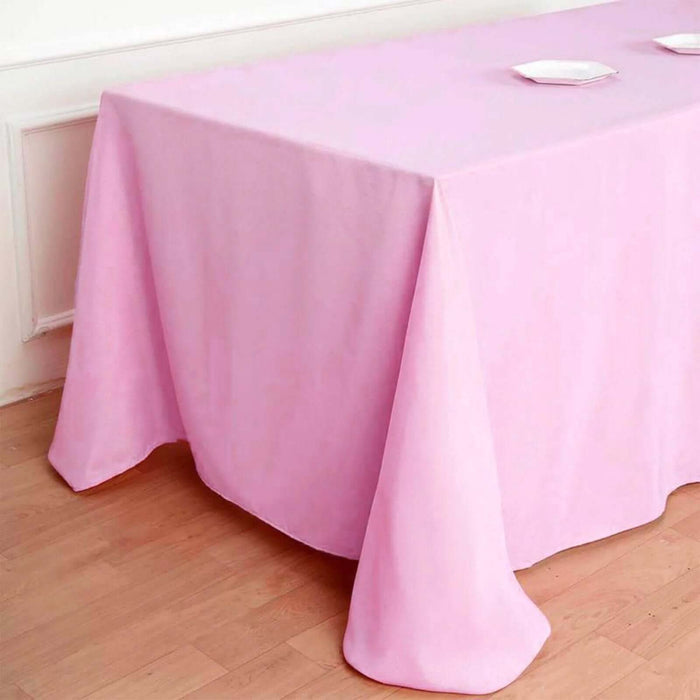 Pink tablecloth draped elegantly over a wooden table.