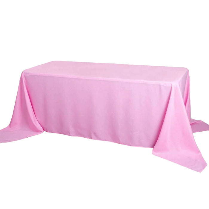 Pink rectangular tablecloth draped elegantly over a table.