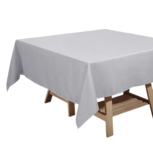 Gray tablecloth draped over a wooden table