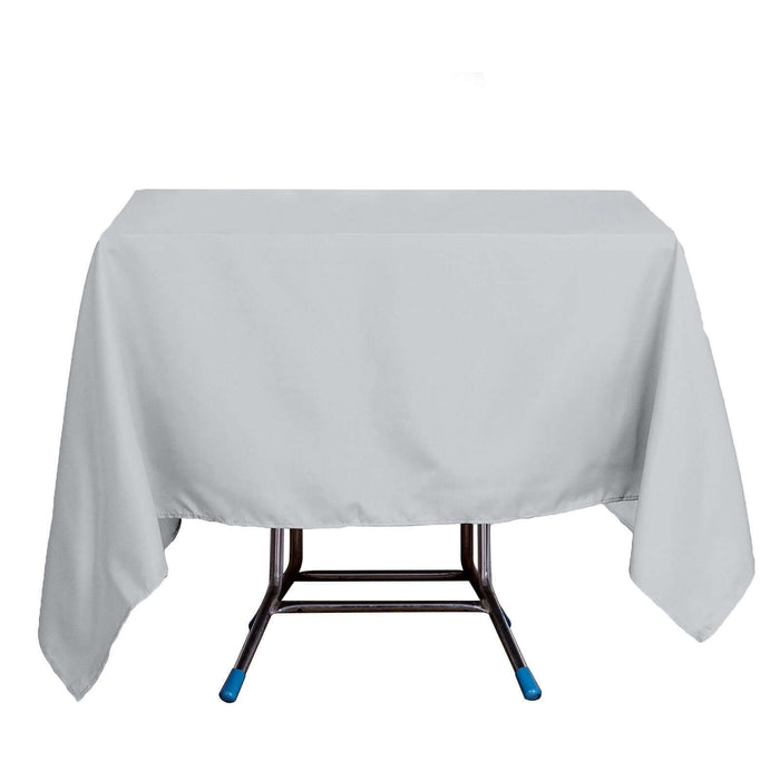 Gray tablecloth draped over a folding table.