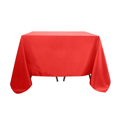 Red tablecloth on a table with smooth draping.