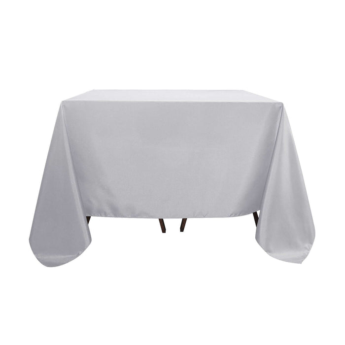 Gray tablecloth draped over a table in a studio-style shot.