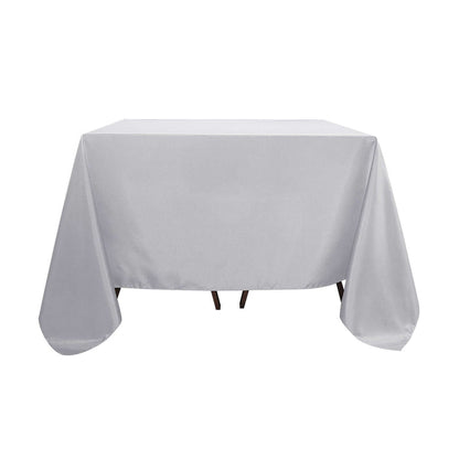 Gray tablecloth draped over a table in a studio-style shot.