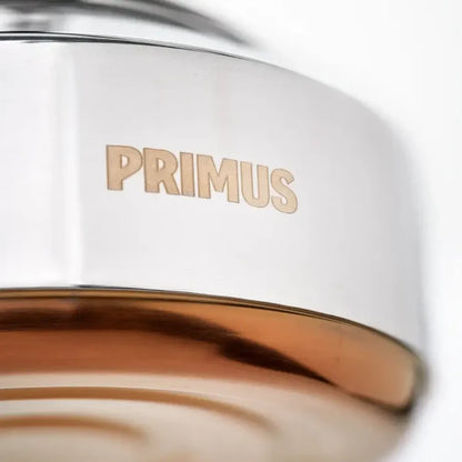 Close-up copper base detail on a Primus Campfire Stainless Steel Kettle 900ml on a white background