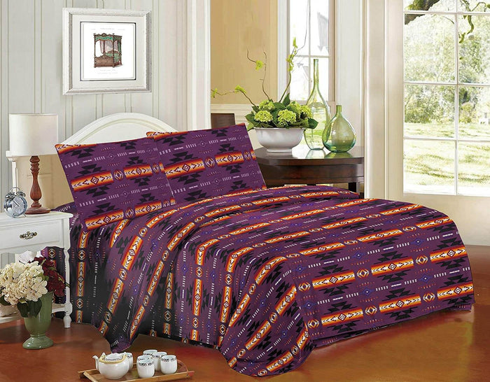 Queen 4pc Sheet Set – Purple with Navajo print design displayed on a bed with bedside table and decor.