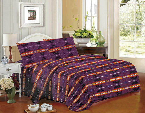 Queen 4pc Sheet Set – Purple with Navajo print design displayed on a bed with bedside table and decor.