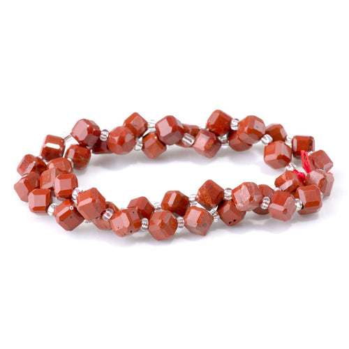 This is a Dakota Stones 6x8mm Red Jasper Corner Gemstone strand with A grade table-cut cube beads in 15-16 inch strand.