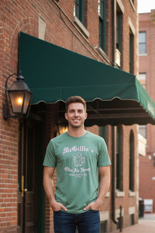 Green t-shirt with white text and beer mug graphic
