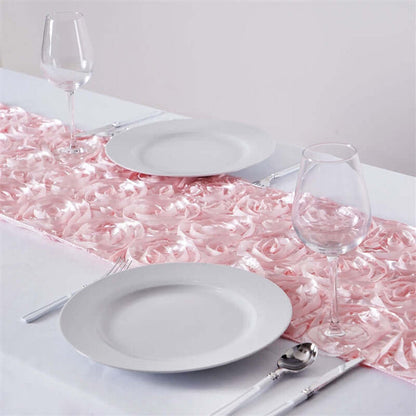 Pink rose-patterned table runner on a dining table with plates and glasses.