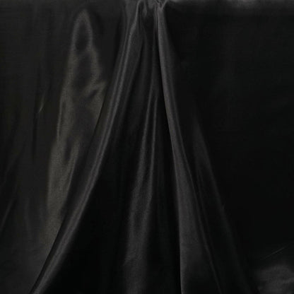 Black satin fabric with smooth texture and elegant drape.