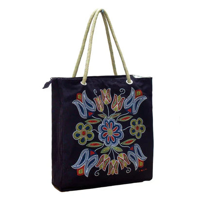 Black tote bag with colorful floral embroidery and rope handles on a white background