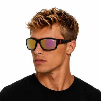Man looking to the side whilst wearing Sinner Cayo Polarised Sport Sunglasses In Red on a white background