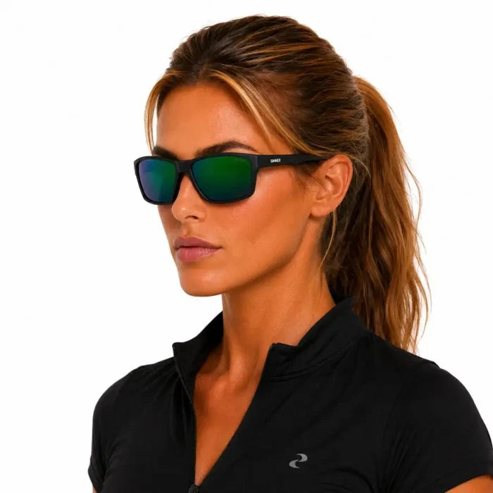 Woman wearing a pair of Sinner Eyak polarised sunglasses in Cry Black on a white background