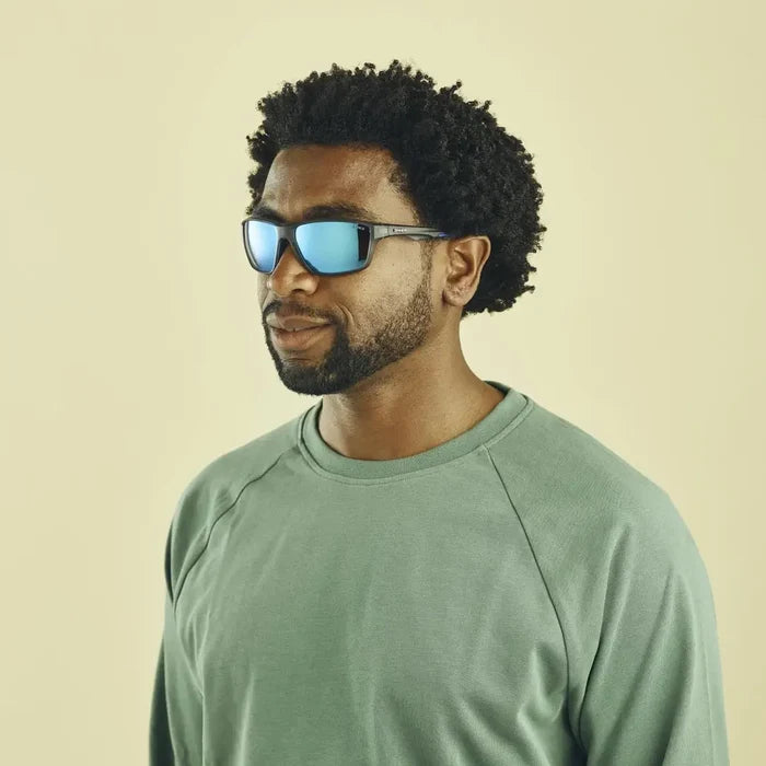 Lifestyle shot of a man wearing Sinner Eyak polarised sunglasses in cry grey