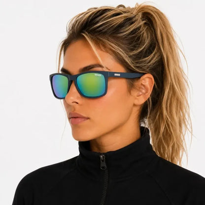 Woman wearing a pair of Sinner Oak Polarised Sunglasses in navy shown from the side on a white background