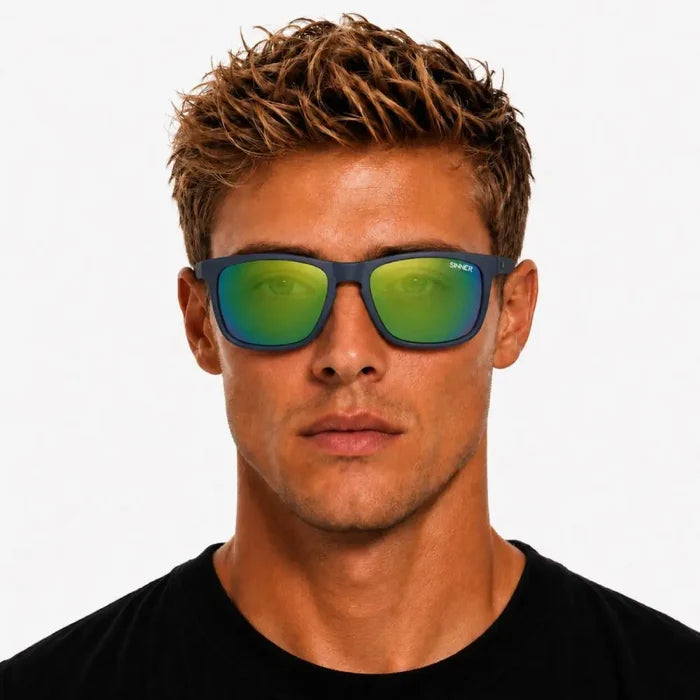 Man wearing a pair of Sinner Oak Polarised Sunglasses in navy shown from the front on a white background
