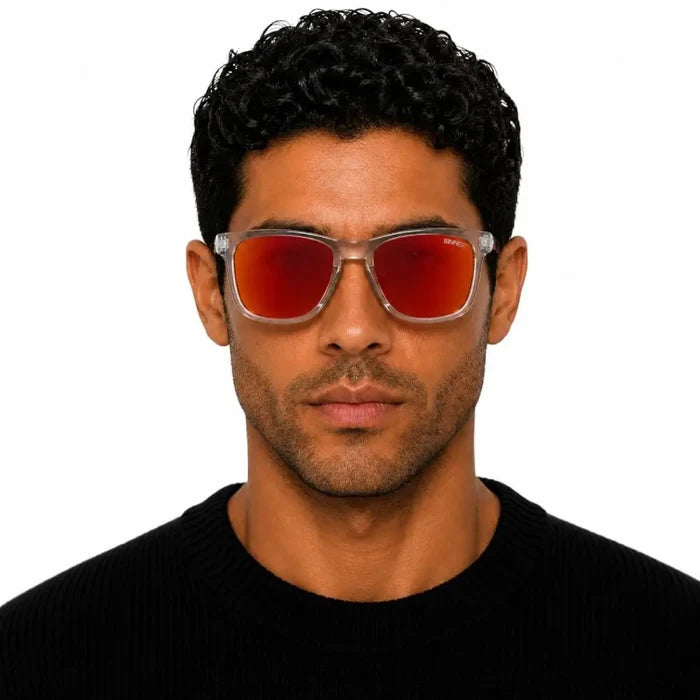 Man staring straight ahaead whilst wearing Sinner Pataua Polarised Sunglasses in grey on a white background