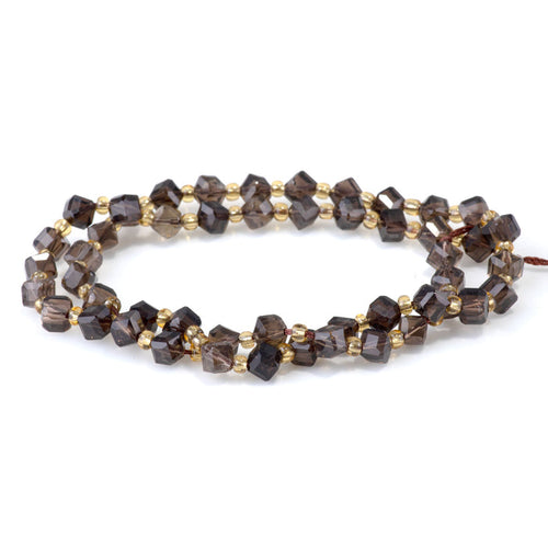 This is a Dakota Stones 4x6mm Smoky Quartz Corner Gemstone strand with table-cut cube beads in 15-16 inch strand.