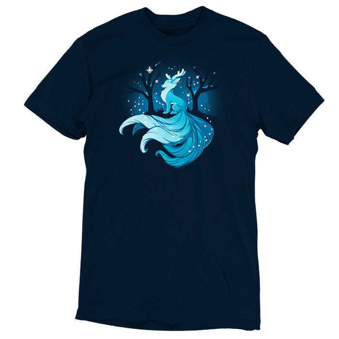Premium Cotton T-shirt_TeeTurtle navy blue Winter Kitsune featuring a blue, fox-like creature with antlers, long tails, and a flowing mane sitting in a snowy forest with bare trees.