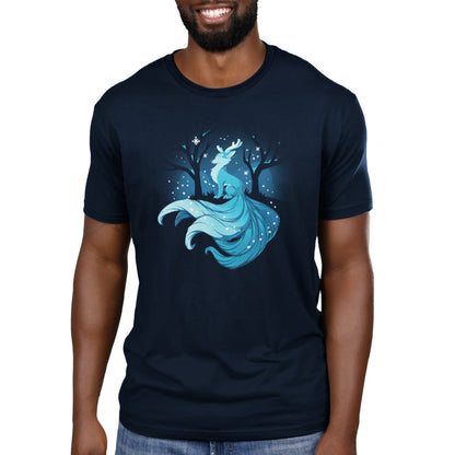 Premium Cotton T-shirt_TeeTurtle navy blue Winter Kitsune featuring a blue, fox-like creature with antlers, long tails, and a flowing mane sitting in a snowy forest with bare trees.