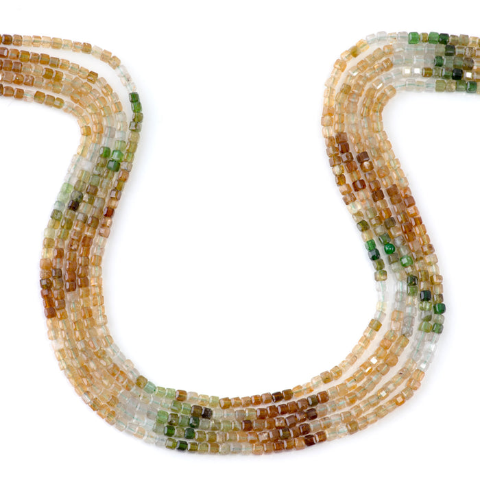 This is a Dakota Stones 3mm Yellow Green Tourmaline Banded Gemstone strand with A grade table-cut cube beads in 15-16 inch strand.